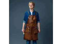 What are the main advantages of using a leather butcher’s apron?