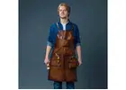 What are the main advantages of using a leather butcher’s apron?